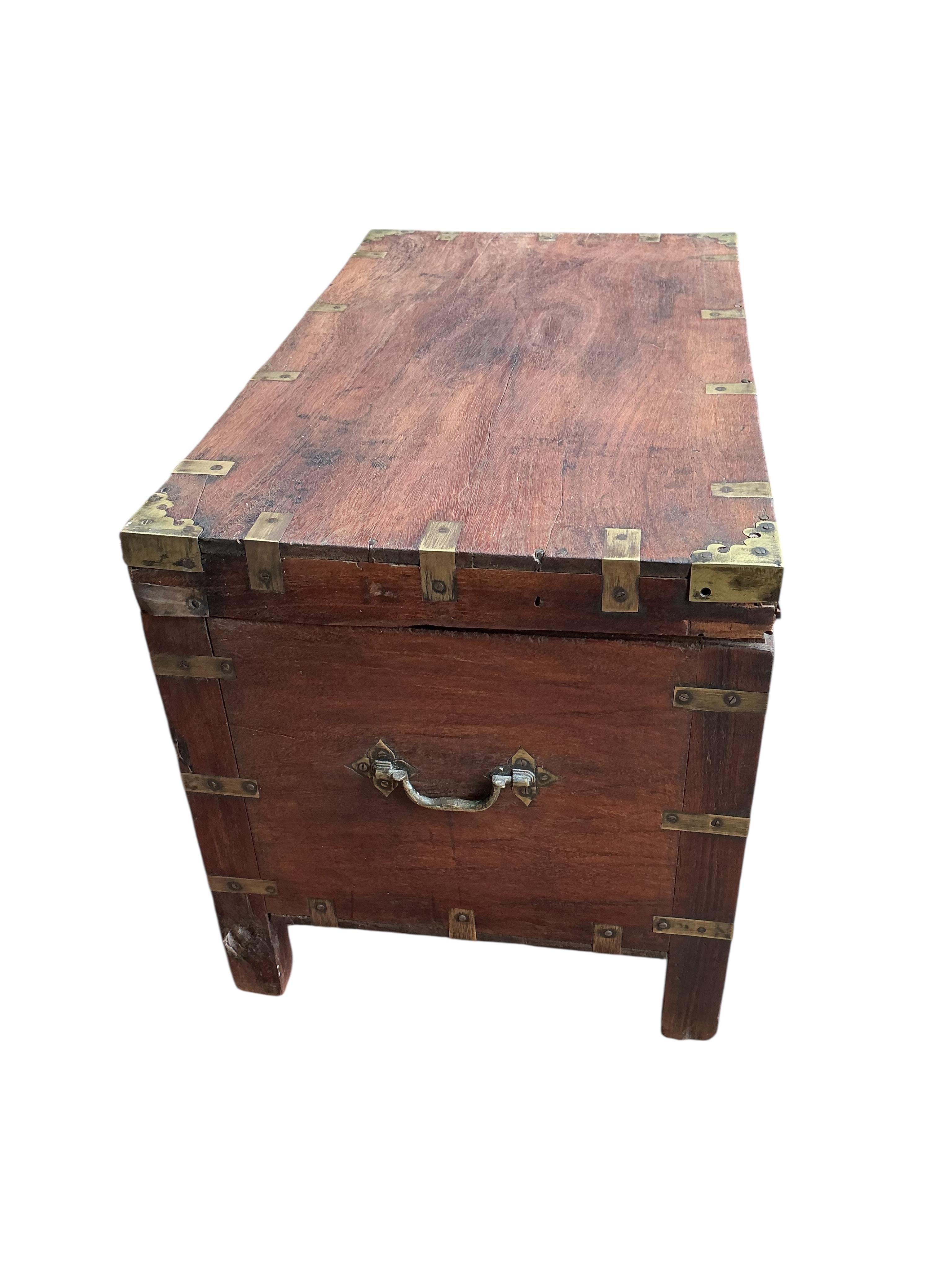 A brass mounted rectangular hardwood trunk, width 72cm, depth 42cm, height 49cm